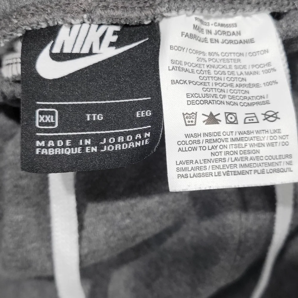 Nike Men's Sportswear Club Fleece Graphic Shorts in gray with a white Swoosh log - Picture 4 of 5